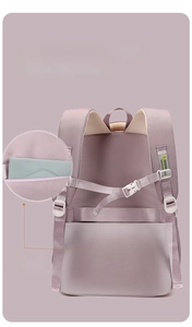 Detail of purple school backpack featuring anti-theft back pocket and adjustable chest straps