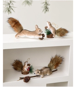 Close-up of fluffy squirrel ornaments with natural pine cones and wooden bases for Christmas