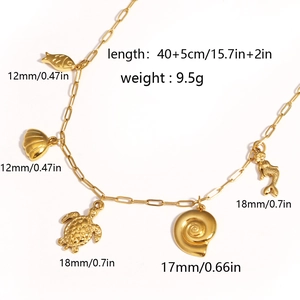 Golden stainless steel ocean theme necklace with mermaid shell and turtle charms for beach style
