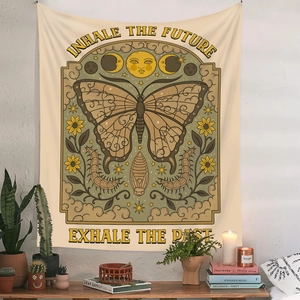 Detail of bohemian butterfly tapestry with sun and moon phases on white wall