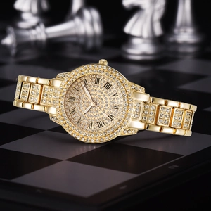Luxury gold watch with crystal dial and roman numerals on a checkerboard background