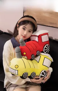 Detail of soft plush toy train with cute fabric patchwork and vibrant colors