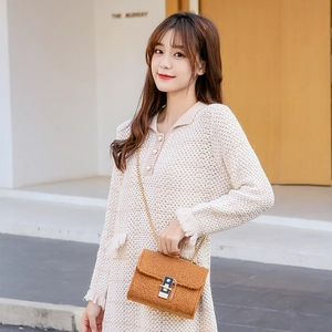 Women's autumn beige knit dress paired with a brown plush chain crossbody bag