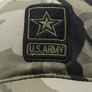 Close-up of military camouflage fabric and U.S. ARMY embroidered patch on baseball cap