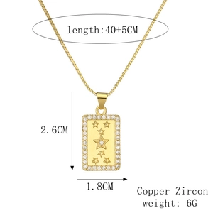 Detailed view of gold rectangle star pendant with zircon borders and chain measurements