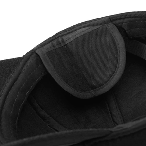 Detailed macro view of the inner stitching and sweatband of this black cotton baseball cap