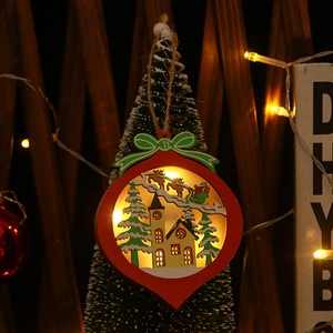 Macro view of glowing wooden Christmas ornament with warm LED light and festive hollow carvings