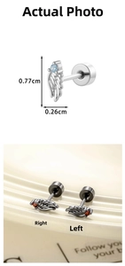 Macro detail of angel wing cartilage stud earrings with size specs and gemstone accents