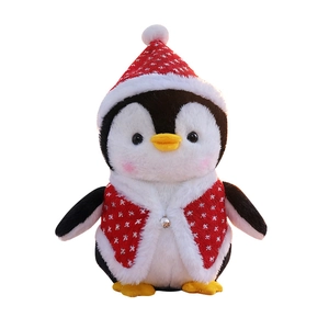 Plush penguin toy with a red Christmas hat and snowflake vest on a white background