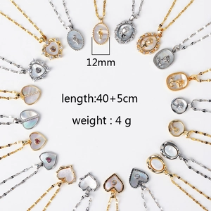 Detailed view of 12mm shell pendant necklaces with engraved patterns and 40cm chain