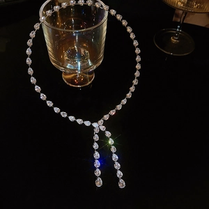 Detail view of silver zircon choker featuring pear-cut stones and elegant Y-shaped tassels