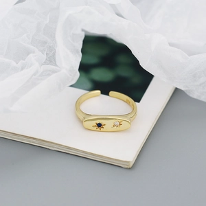 Detail of S925 silver gold ring featuring blue and white star-shaped cubic zirconia stones