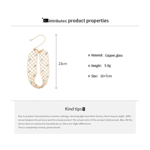 Detail view of 23cm gold-plated hollow mesh bracelet with light blue glass crystal beads