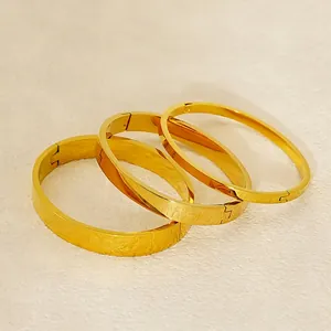 Three-piece set of minimalist polished 18K gold plated stainless steel bangles for women