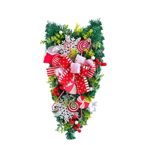 Christmas upside down tree swag with red and white candy canes and pine needles