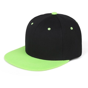 Detail of a black snapback hat with neon green flat brim and matching top button