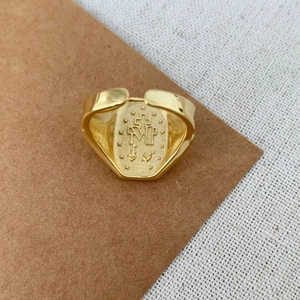 Close-up of S925 sterling silver religious ring with M cross heart engraving