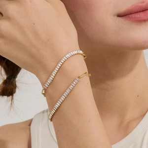 Close-up of 18k gold-plated stainless steel zircon bracelets worn on a model wrist