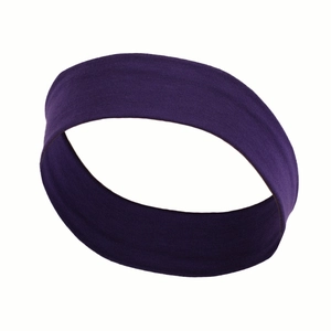 Detailed close-up of dark purple elastic sports headband made from soft breathable fabric