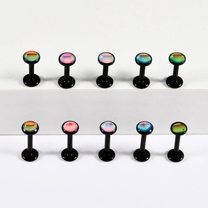 Close-up of multicolored gradient stud earrings on white display stand