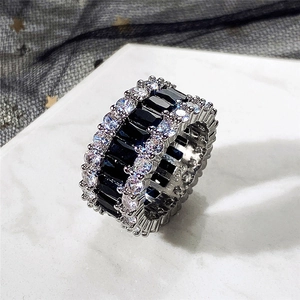 Macro shot of S925 sterling silver ring with three-row baguette black stones and zircons