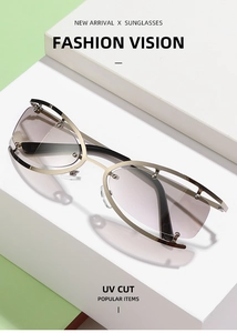 Close-up of champagne gold metal frame and gradient gray-pink UV CUT lenses on sunglasses