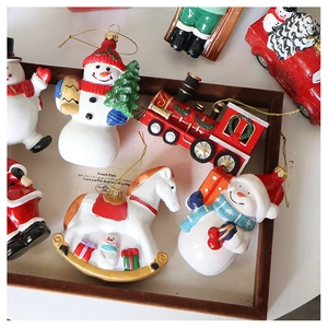 Detailed close-up of diverse Christmas tree ornaments like snowmen and vintage trains