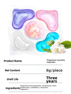 Detailed view of multi-chamber 5D laundry pods with scent beads and jasmine flower