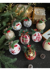 Detail of Christmas plaid balls with pine cones berries and rustic needles decor