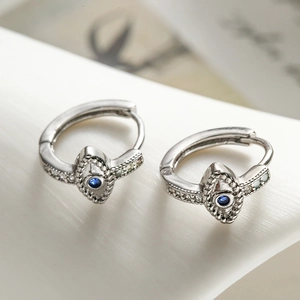 Silver Evil Eye hoop earrings with blue zircon stones in a retro minimalist style