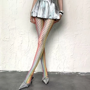 Detailed shot of rainbow gradient wide mesh fishnet stockings with glittering rhinestones