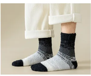 Detail of thick winter sleep socks for men with black and grey gradient coral fleece fabric