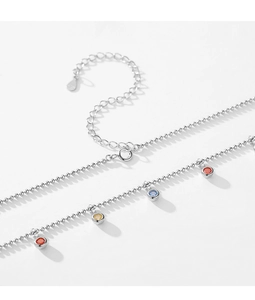 Macro shot of S925 sterling silver chain featuring colorful round zircon gemstone charms