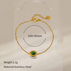 Detail view of gold stainless steel chain bracelet with green stone and size specs