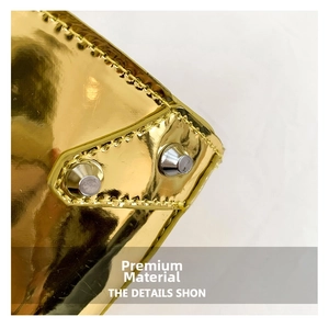 Detailed close-up of metallic gold PU leather surface with silver rivets and stitching