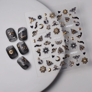 Gold embossed moth nail stickers with occult moon and sun patterns in black and white