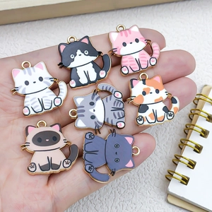 Handheld display of seven cute enamel cat charms made of alloy for DIY jewelry making