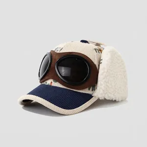 Close-up of kids' winter aviator hat featuring corduroy fabric and pilot goggles detail