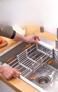 Close-up of adjustable stainless steel sink rack with telescopic design for kitchen use