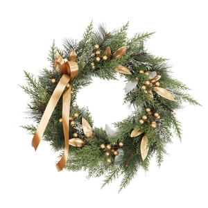 Handcrafted Christmas wreath with golden berries and pine needles for holiday door decoration