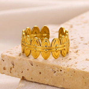 Macro shot of 18k gold plated stainless steel open ring with geometric oval patterns