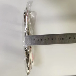 Close-up of stacked Christmas door frame decorations in packaging showing 3cm thickness