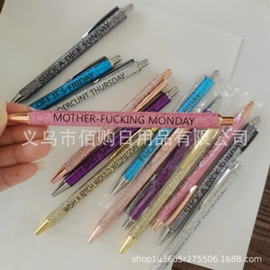 Set of 7 colorful glitter pens with bold slogans and a pink ballpoint pen focus