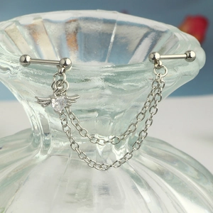 Detailed close-up of stainless steel screw back ear piercing with heart zircon and chains