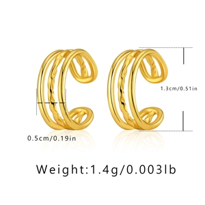 Macro detail of 18K gold plated C-shape ear cuff showing polished and twisted textures