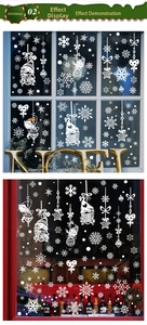 White Christmas window decals featuring snowflakes and gnomes on a glass pane
