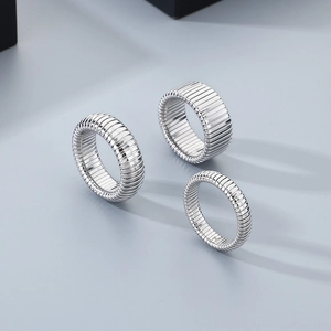 Detailed view of silver textured stainless steel rings with unique tubogas ribbing design