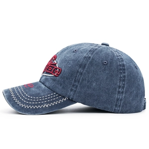 Distressed dark blue washed denim baseball cap with vintage red 3D embroidery on front