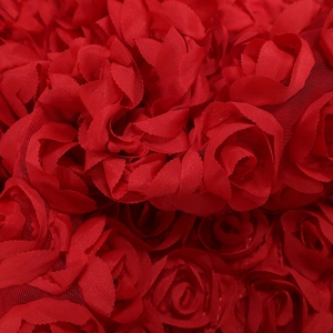 Detailed macro shot of bright red 3D rose fabric with layered chiffon petals