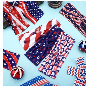 Flat lay of knotted Independence Day headbands with various American flag star and stripe patterns